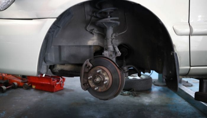 How do I lower the suspension on my Jeep Wrangler?
